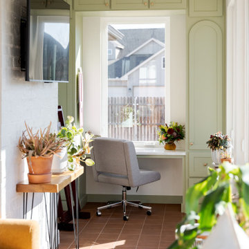 Arched Built-Ins Meet Terracotta Tile in a Light-Filled Sunroom Addition