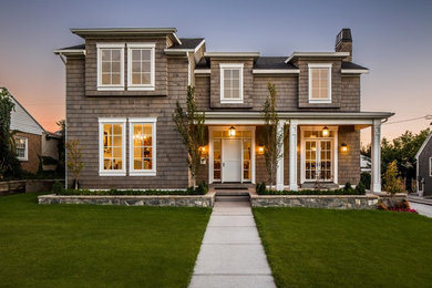 Inspiration for a traditional two-storey grey exterior in Salt Lake City with wood siding.