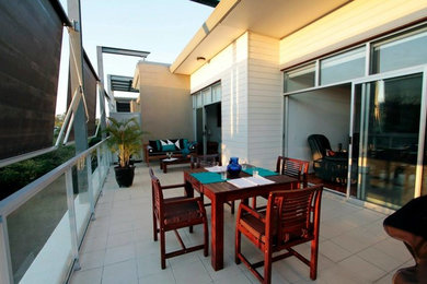 Design ideas for a mid-sized contemporary balcony in Brisbane with no cover.