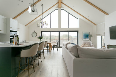This is an example of an expansive rural living room in Other with a wall mounted tv.