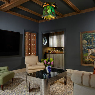 Tuscan enclosed carpeted and gray floor family room photo in Miami with a bar, blue walls and a wall-mounted tv