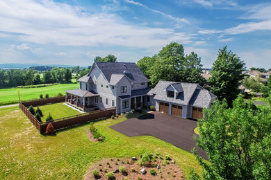 Huge arts and crafts gray two-story exterior home photo in Burlington