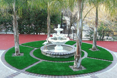 Design ideas for a mid-sized contemporary full sun backyard brick water fountain landscape in San Francisco.