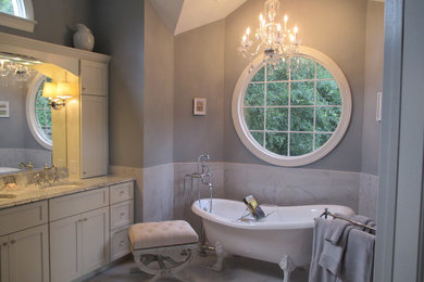 Example of a classic master porcelain tile porcelain tile bathroom design in Charlotte with white cabinets, marble countertops and gray walls