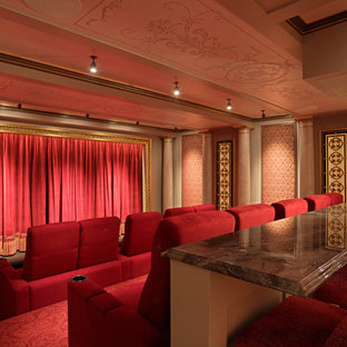 Home theater - huge traditional carpeted and red floor home theater idea in Boston with brown walls