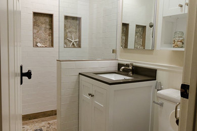 Example of a small beach style 3/4 white tile and subway tile ceramic tile alcove shower design in San Francisco with an undermount sink, shaker cabinets, white cabinets, quartz countertops and beige walls