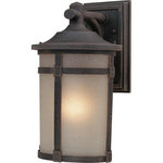 Artcraft - St. Moritz 1-Light Bronze Outdoor Light - Small outdoor wall mount (lantern-down) with caramelized linen glassware in rich bronze finish Warranty 5 year warranty against premature paint defects and a 25 year limited warranty against corrosion. Artcraft products are made of the finest material available and are carefully manufactured with old fashion Artisans using the most advanced techniques in order to provide you beautiful lighting. Although user serviceable items like bulbs ballasts and transformers do require periodic replacements we use only the highest performance components available. We thank you for choosing Artcraft.