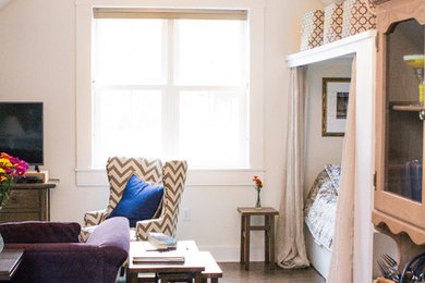 Inspiration for a mid-sized eclectic loft-style dark wood floor living room remodel in Indianapolis with a tv stand and beige walls