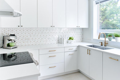 Inspiration for a small modern u-shaped separate kitchen in Toronto with a double-bowl sink, flat-panel cabinets, white cabinets, quartz benchtops, multi-coloured splashback, mosaic tile splashback, stainless steel appliances, porcelain floors, no island, beige floor and white benchtop.