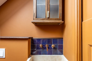 This is an example of an eclectic bathroom in London.