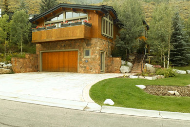 Large rustic brown split-level mixed siding exterior home idea in Denver with a hip roof and a shingle roof
