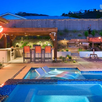 Backyard with Pool.Hot Tub, Outdoor Kitchen, Bocce Court, and Built-In Bench