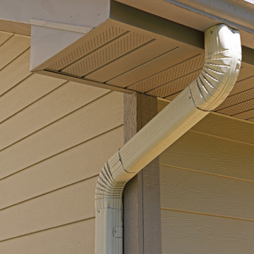 High-capacity gutters and downspouts