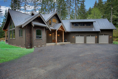 Inspiration for a large timeless brown two-story wood exterior home remodel in Seattle