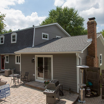 Naperville home with renovated exterior and gambrel roof.