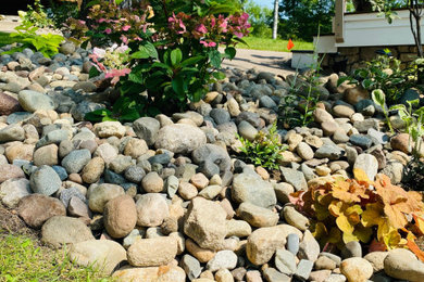 Photo of a small eclectic hillside landscaping in Other.