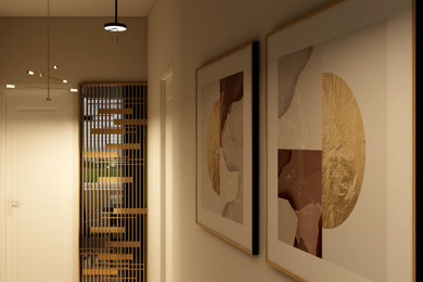 Immagine di un piccolo ingresso o corridoio minimalista con pareti bianche e pavimento in laminato
