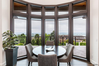Inspiration for a large transitional medium tone wood floor and brown floor dining room remodel in Portland with white walls