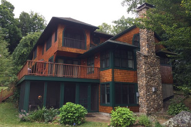 Large arts and crafts side yard deck photo in Burlington