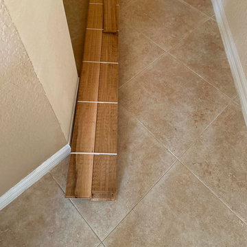 Hardwood Floor + Stair Stringer Fascia + Baseboard Trim + Paint