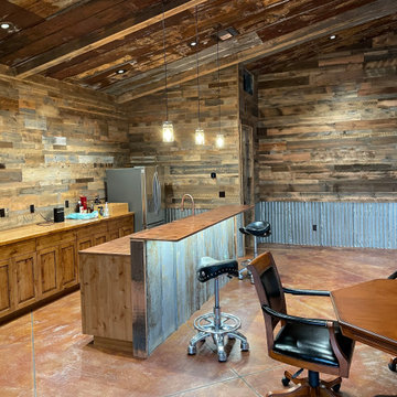 Man Cave- Reclaimed wood walls, rusty metal, barn doors