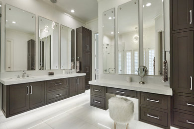Example of a transitional master porcelain tile, white floor and double-sink freestanding bathtub design in Dallas with recessed-panel cabinets, white walls, an undermount sink, quartz countertops, a hinged shower door and a floating vanity