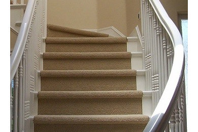 Staircase - mid-sized traditional carpeted curved staircase idea in Los Angeles with carpeted risers