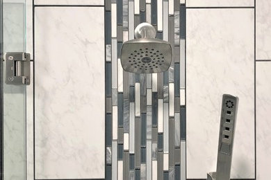 Mid-sized modern master bathroom in Detroit with black cabinets, a curbless shower, white tile, subway tile, white floor, a hinged shower door and multi-coloured benchtops.