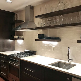 This is an example of a small contemporary basement in Portland with beige walls, bamboo flooring and brown floors.