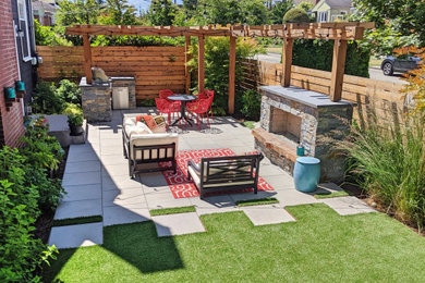 Inspiration for a mid-sized drought-tolerant and full sun side yard concrete paver landscaping in Seattle with a fireplace.