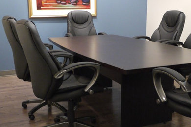 Inspiration for a large contemporary freestanding desk brown floor home office remodel in Vancouver with blue walls