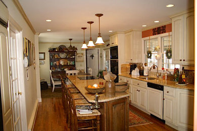 Inspiration for a mid-sized timeless galley dark wood floor kitchen remodel in New York with raised-panel cabinets, white cabinets, granite countertops, stainless steel appliances and an island