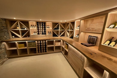 Design ideas for a modern wine cellar in Other with feature lighting.