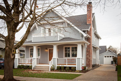Mid-sized elegant gray two-story wood house exterior photo in Orange County with a hip roof and a shingle roof