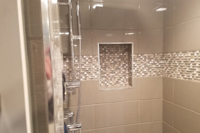 Inspiration for a mid-sized contemporary master gray tile and ceramic tile corner shower remodel in Orange County