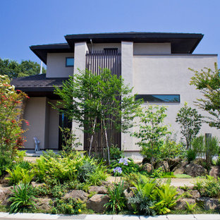 他の地域のアジアンスタイルのおしゃれな前庭 (日向、天然石敷き) の写真