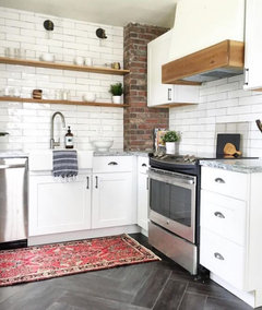 subway tile backsplash next to brick wall?