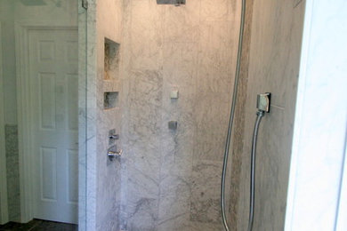 Inspiration for a huge transitional gray tile and stone tile porcelain tile sauna remodel in Charlotte with a vessel sink, shaker cabinets, dark wood cabinets, quartz countertops, a two-piece toilet and blue walls