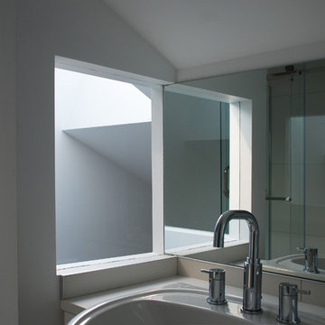 Bathroom borrows light from the skylight