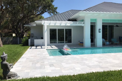 Minimalist stone pool photo in Tampa