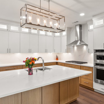 Modern Kitchen Island and Stainless Steel Appliance Wall After Remodel