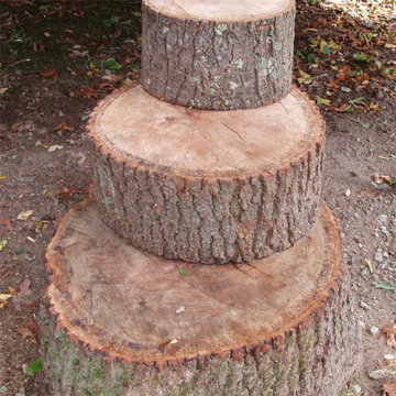 Hewn log stackers for play area