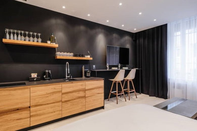 Inspiration for a medium sized contemporary single-wall kitchen/diner in Other with a submerged sink, granite worktops, black splashback, ceramic splashback, integrated appliances, marble flooring and no island.