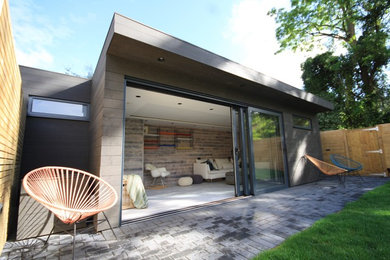 This is an example of a mid-sized contemporary detached studio in Surrey.
