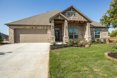 Beige one-story brick gable roof photo in Dallas
