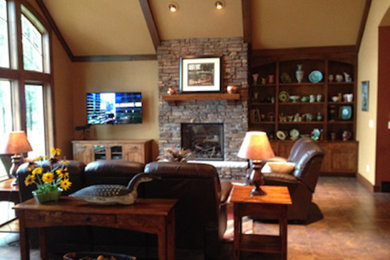 Mid-sized transitional formal and enclosed medium tone wood floor living room photo in Other with beige walls, a standard fireplace, a stone fireplace and a wall-mounted tv