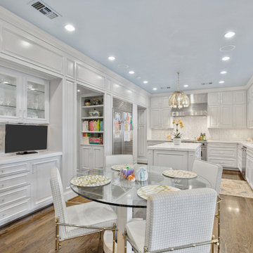 Bright and Elegant Kitchen with Glass Dining Table and Custom Cabinetry