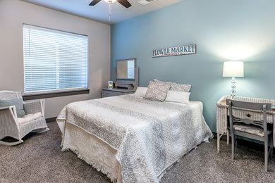 Example of a mid-sized guest carpeted bedroom design in Denver