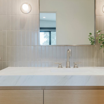 Tile Feature Wall with Calcutta Marble Countertops