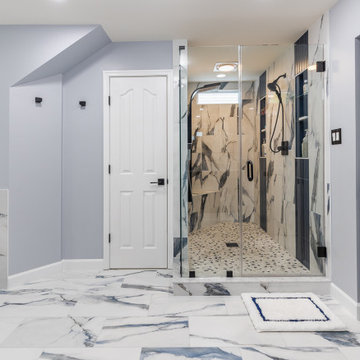Bathroom remodeling in Columbia, MD with double vanity & marble bathtub